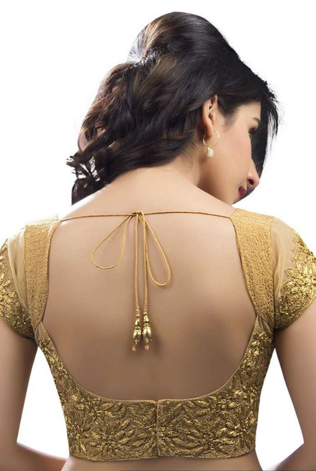 woman golden open back blouse spring summer 2024